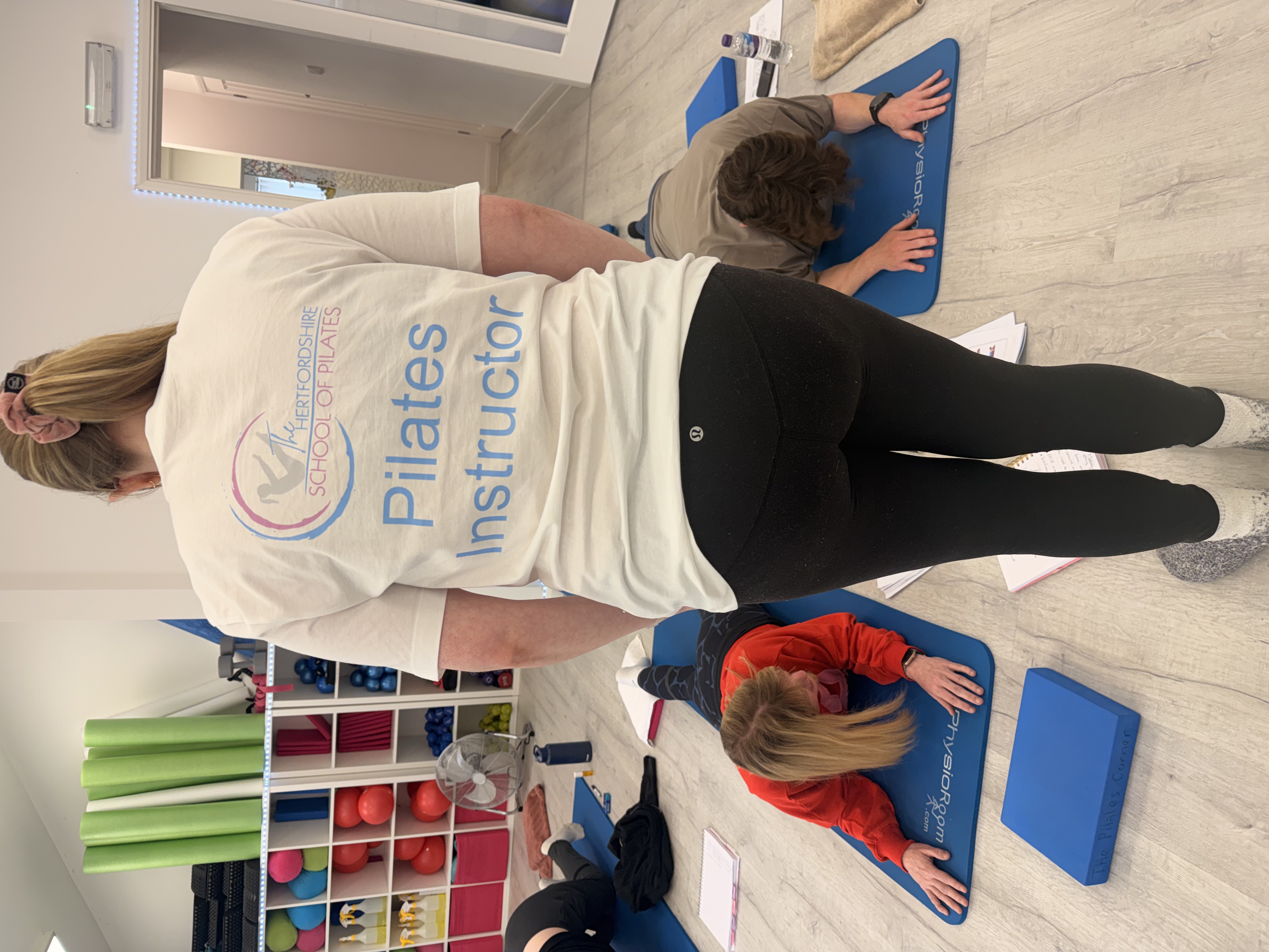 Laura teaching Chelsea and Charley at The Hertfordshire School of Pilateselock teaching Pilates at The Hertfordshire School of Pilates