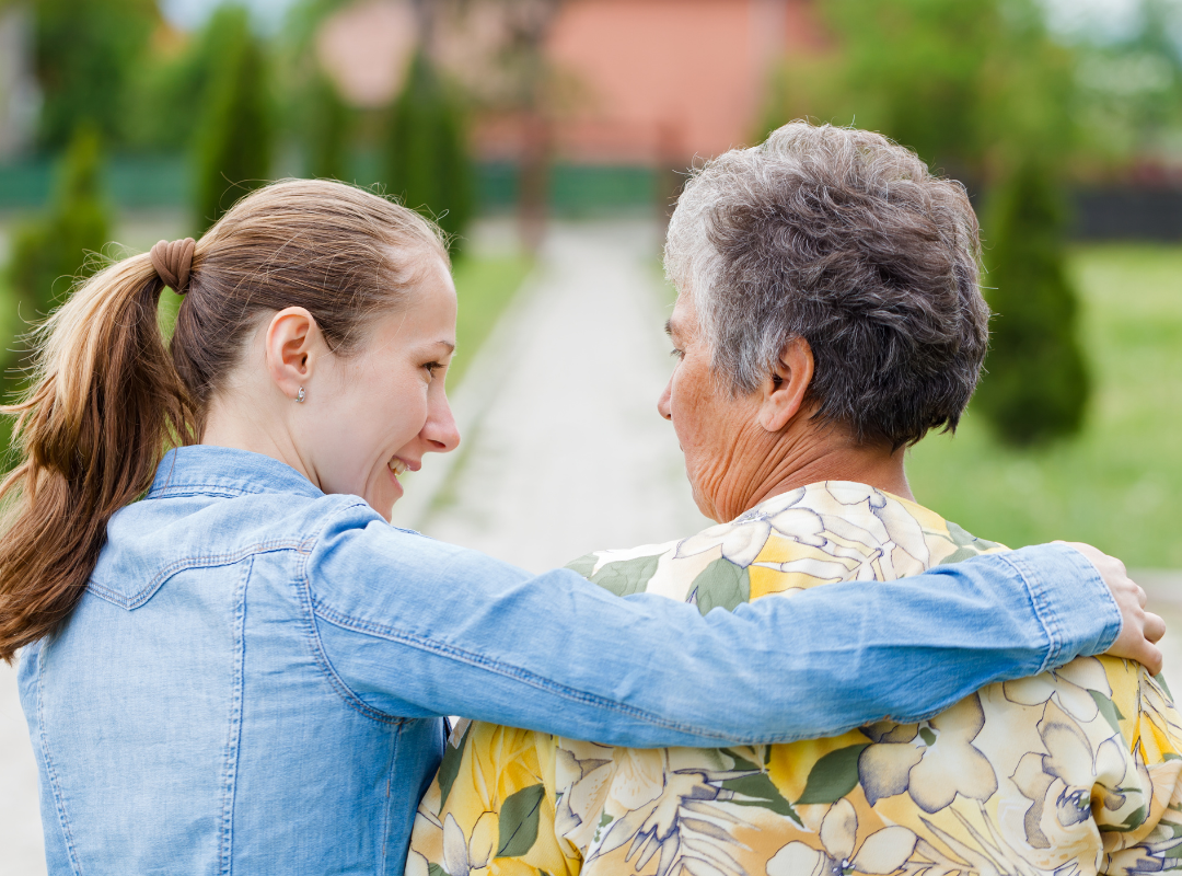 A Woman talking with an Elderly woman