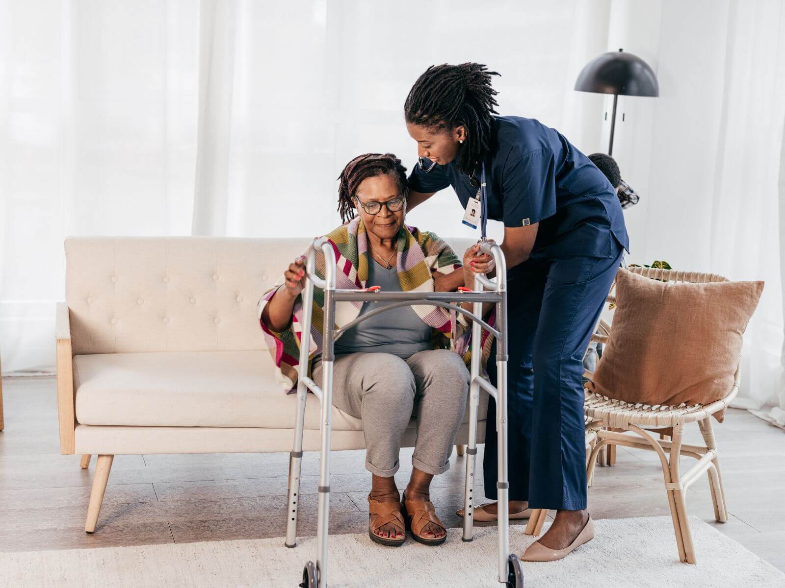 Caregiver assists an elderly woman in a wheelchair