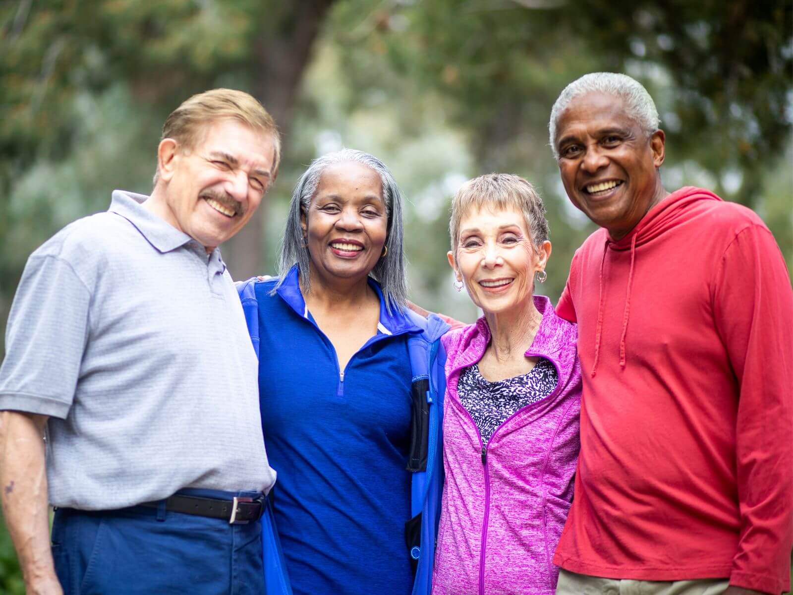 A group of four seniors standing in a group picture