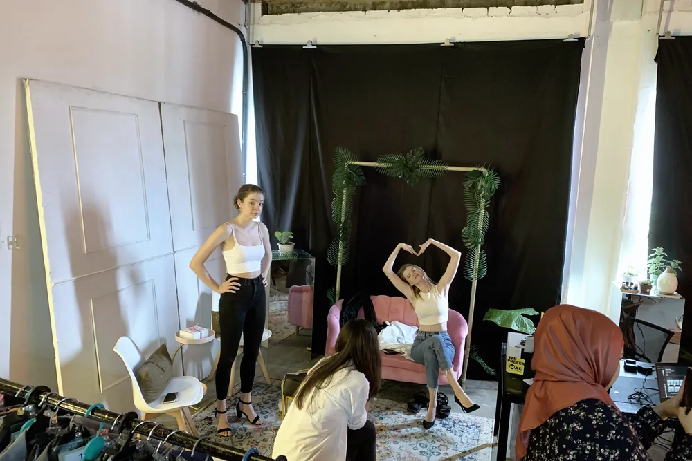 Talent on a styled studio set during a commercial portrait shoot