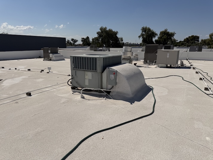 Rush HVAC Services technician working on an AC unit in the East Valley of Phoenix, AZ
