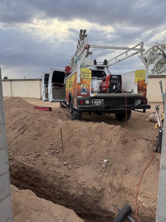 Licensed HVAC contractor truck with ladder rack and AC repair equipment at a job site in Apache Junction, AZ, Rush HVAC Services