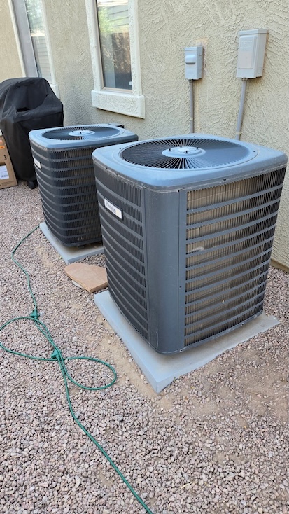 Two outdoor AC condenser units at a Gold Canyon, AZ home serviced by Rush HVAC Services