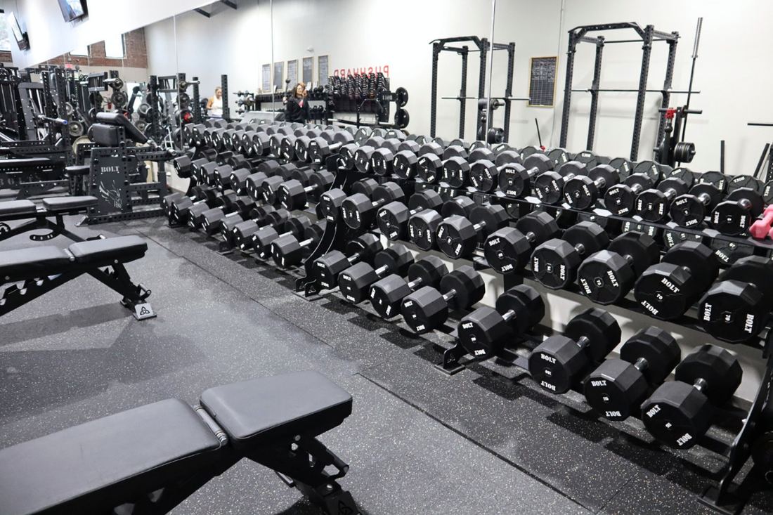 Full dumbbell rack and benches at Push Performance Training in Bixby