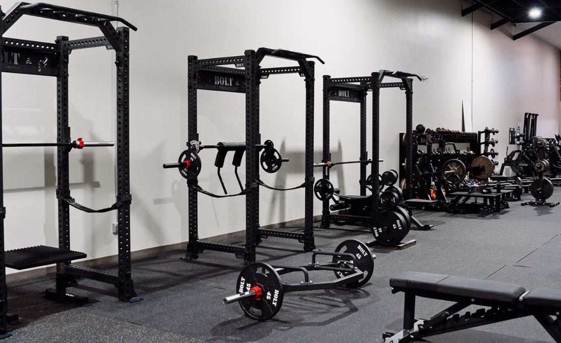 Squat racks and barbells at Push Performance Training in Bixby