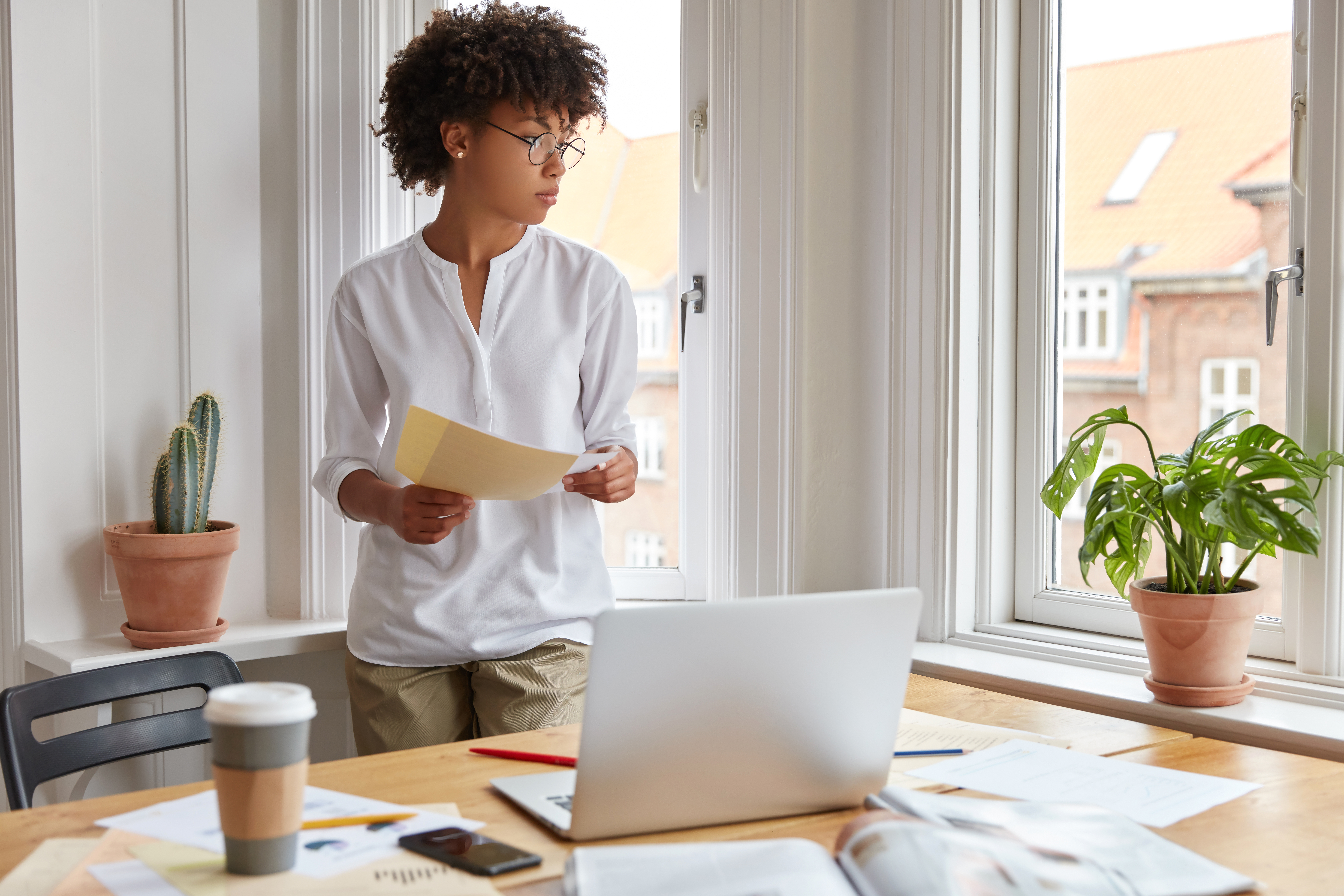 Tenant reviewing financial documents for rental application
