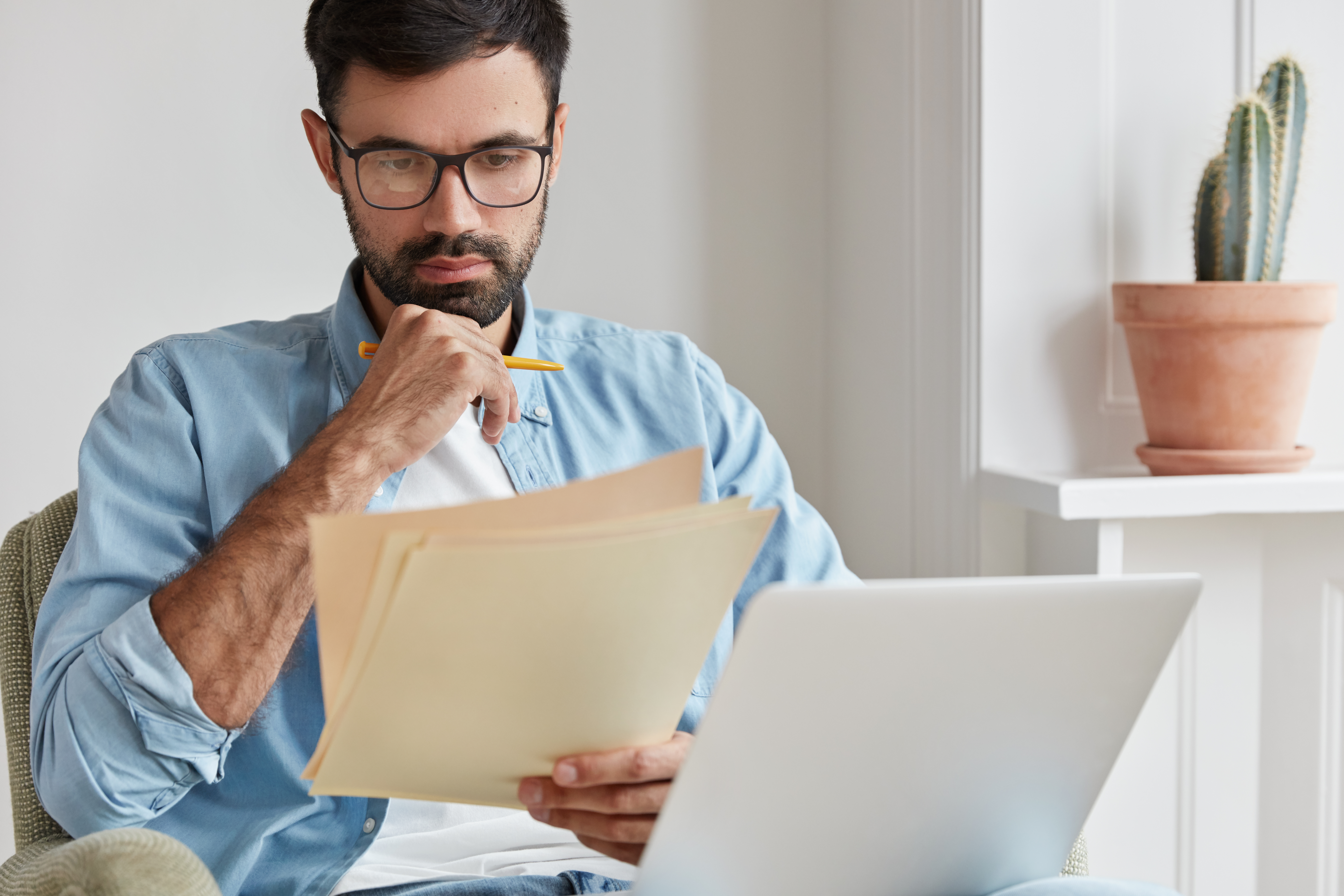 Property manager reviewing tenant income verification documents