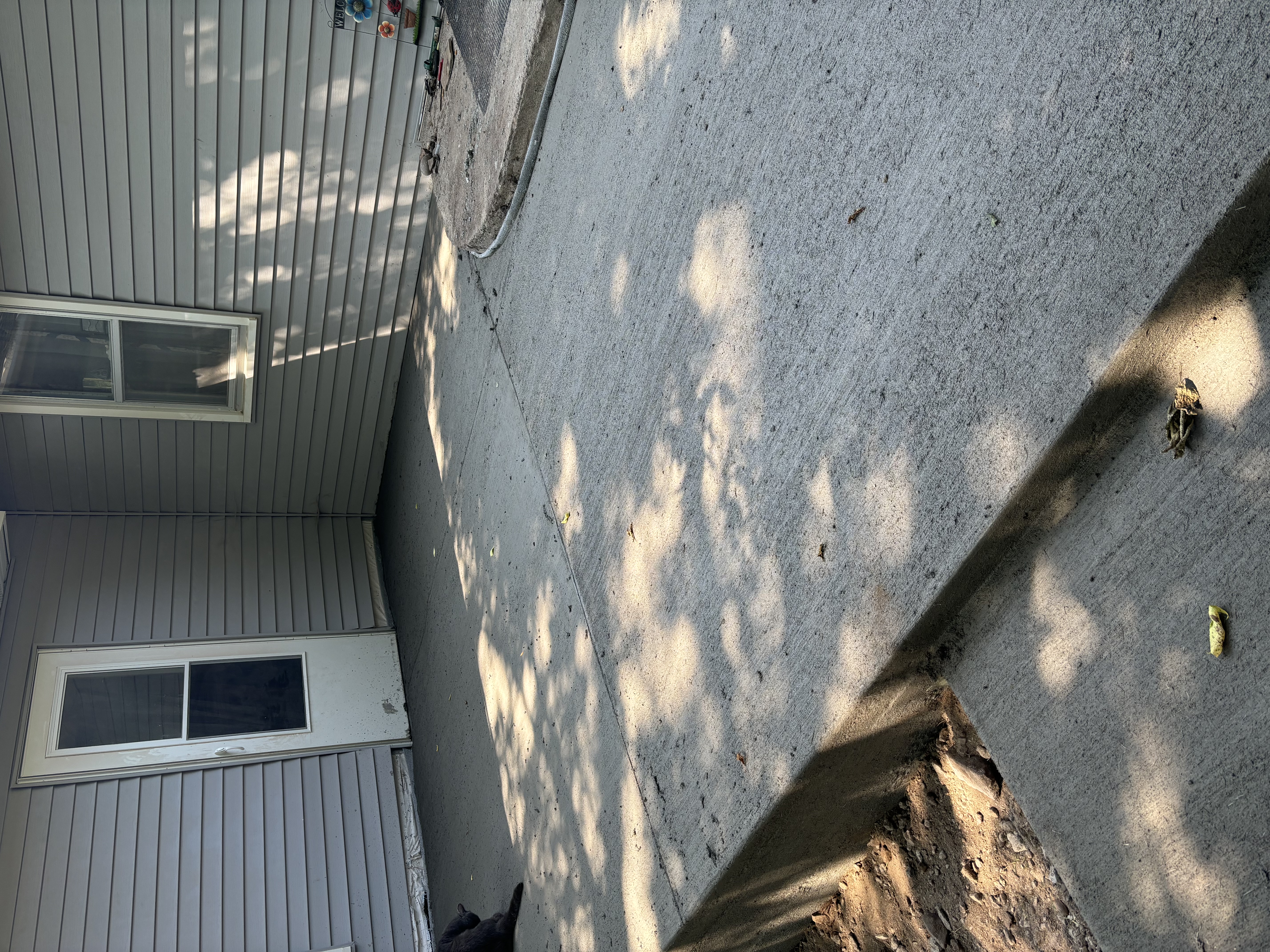 After: a clean, broom-finished concrete slab