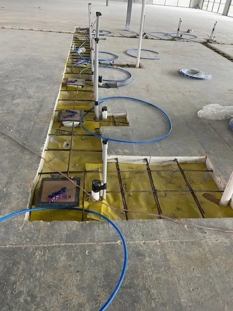 Demolition equipment and crew preparing construction site