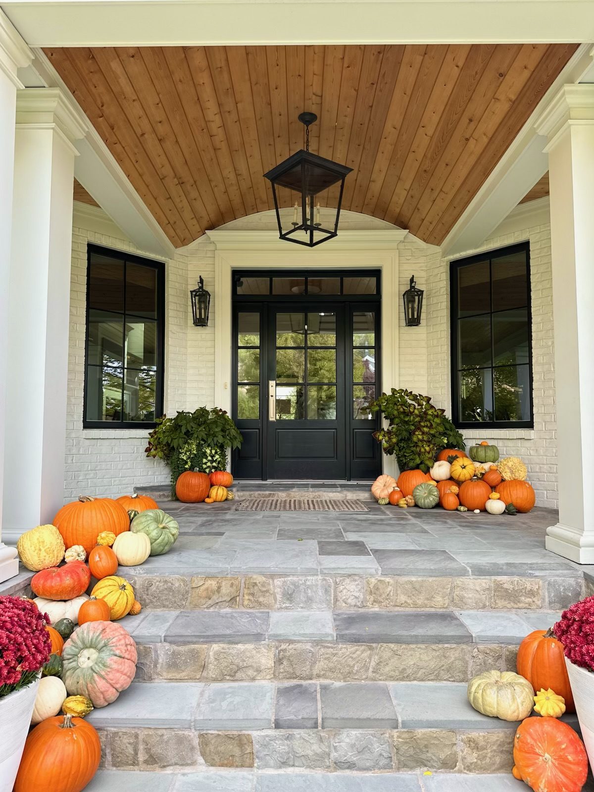 Heirloom pumpkin porch on a modern Utah home with a mountain view