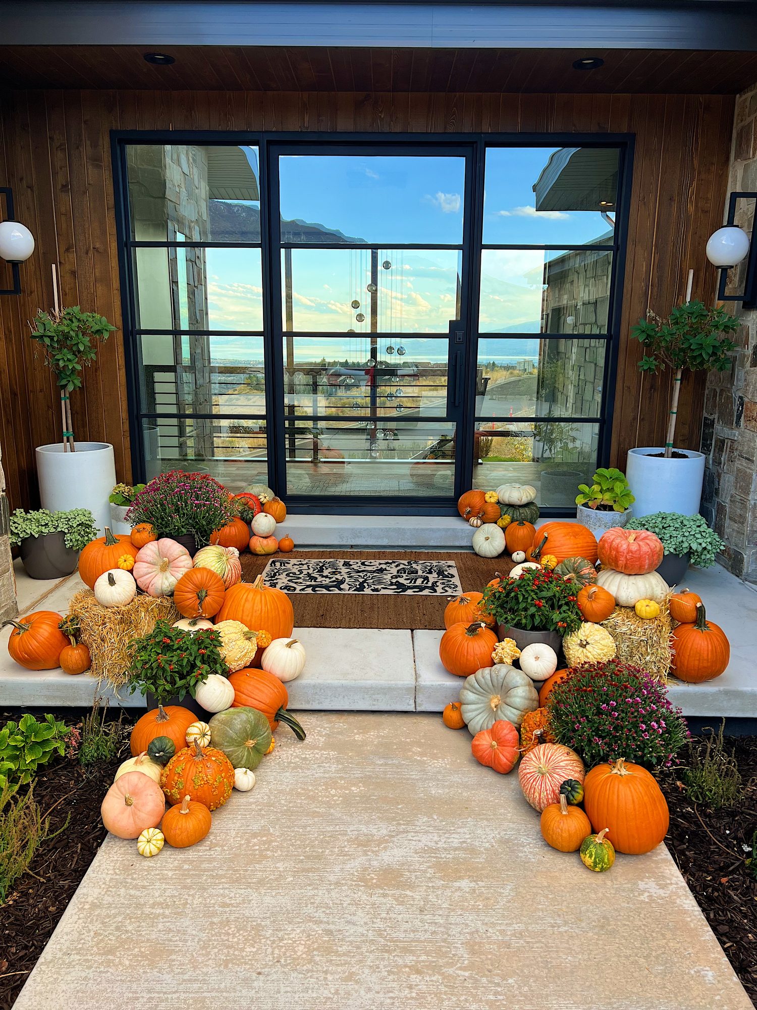 Fall pumpkin styling on a modern Utah front porch