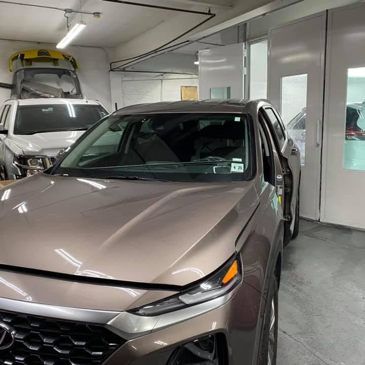 Collision repair in progress at New Auto Body Shop Inc, Newark, NJ