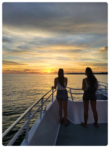 Girls admiring sunset on cruise with The Pelican St Pete