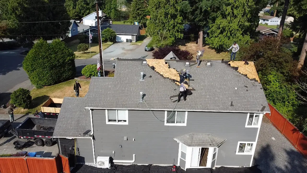 Roosevelt Roofing LLC completing shingle repair on a King County WA residential home