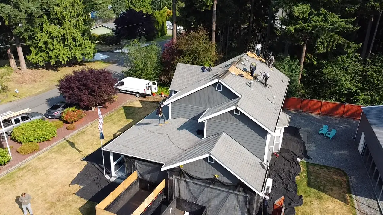 Roosevelt Roofing LLC completing shingle repair on a King County WA residential home