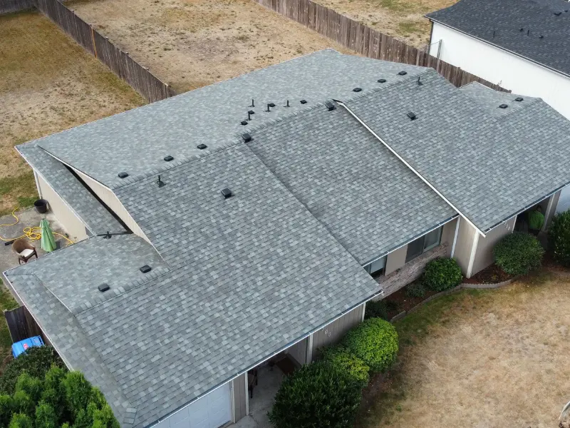 Roosevelt Roofing LLC owner Eric Haugh inspecting a residential roof in Pierce County WA Roosevelt Roofing LLC owner Eric Haugh inspecting a residential roof in Pierce County WA
