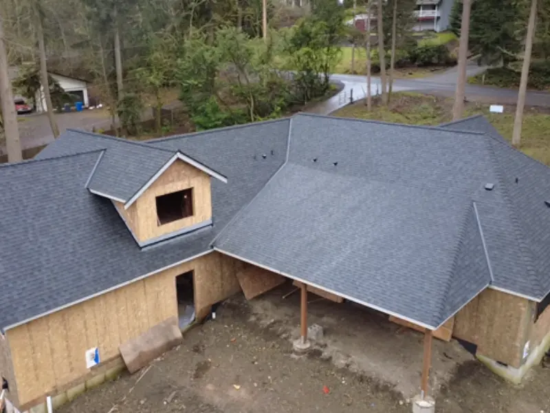 Roofing contractor's completed shingle installation on a new construction home.