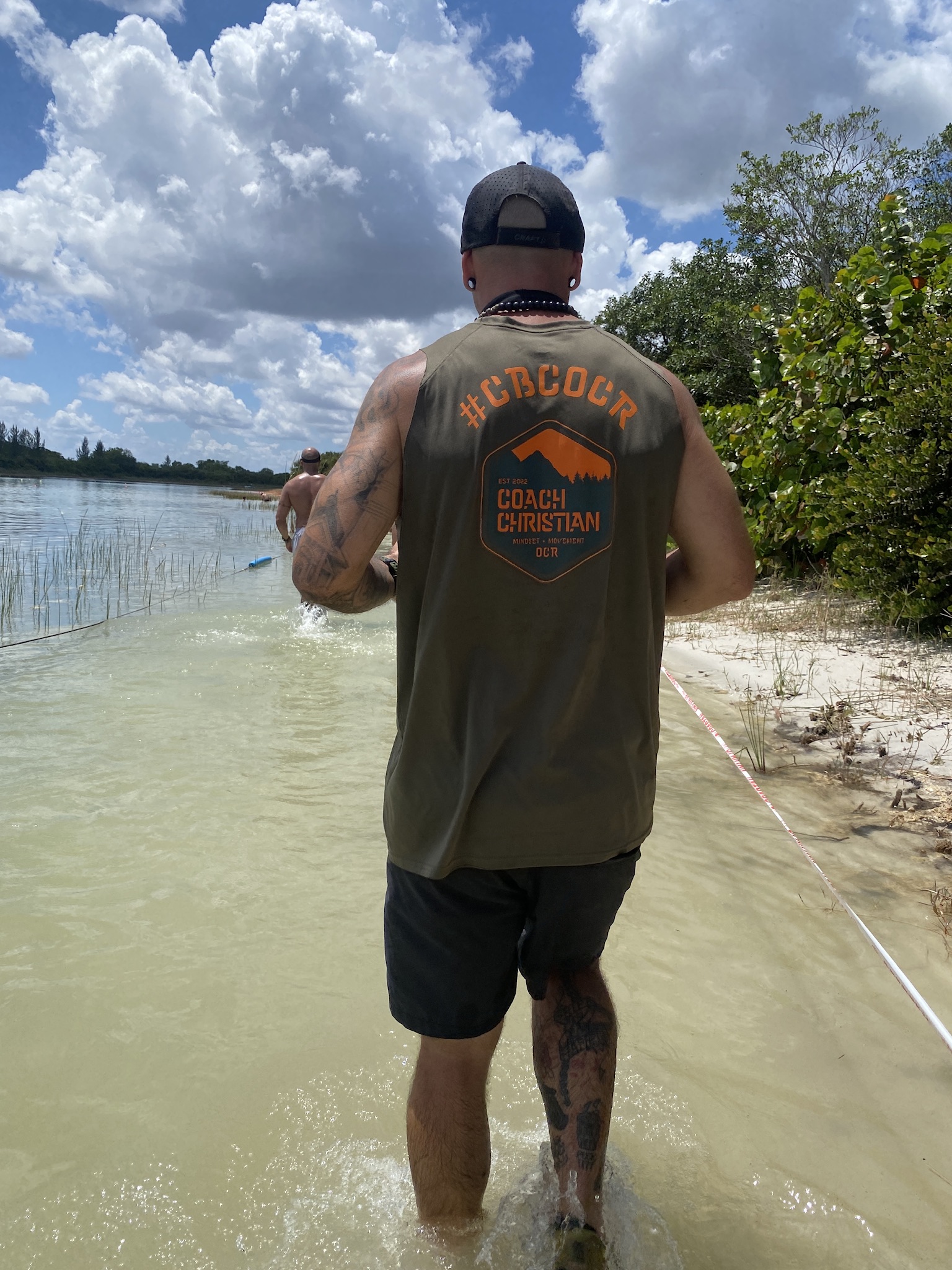 Coach Christian wearing CBC OCR team gear on a course