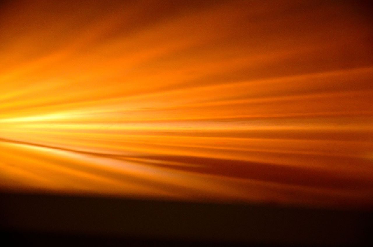 Abstract depiction of golden sun rays creating a warm glowing effect
