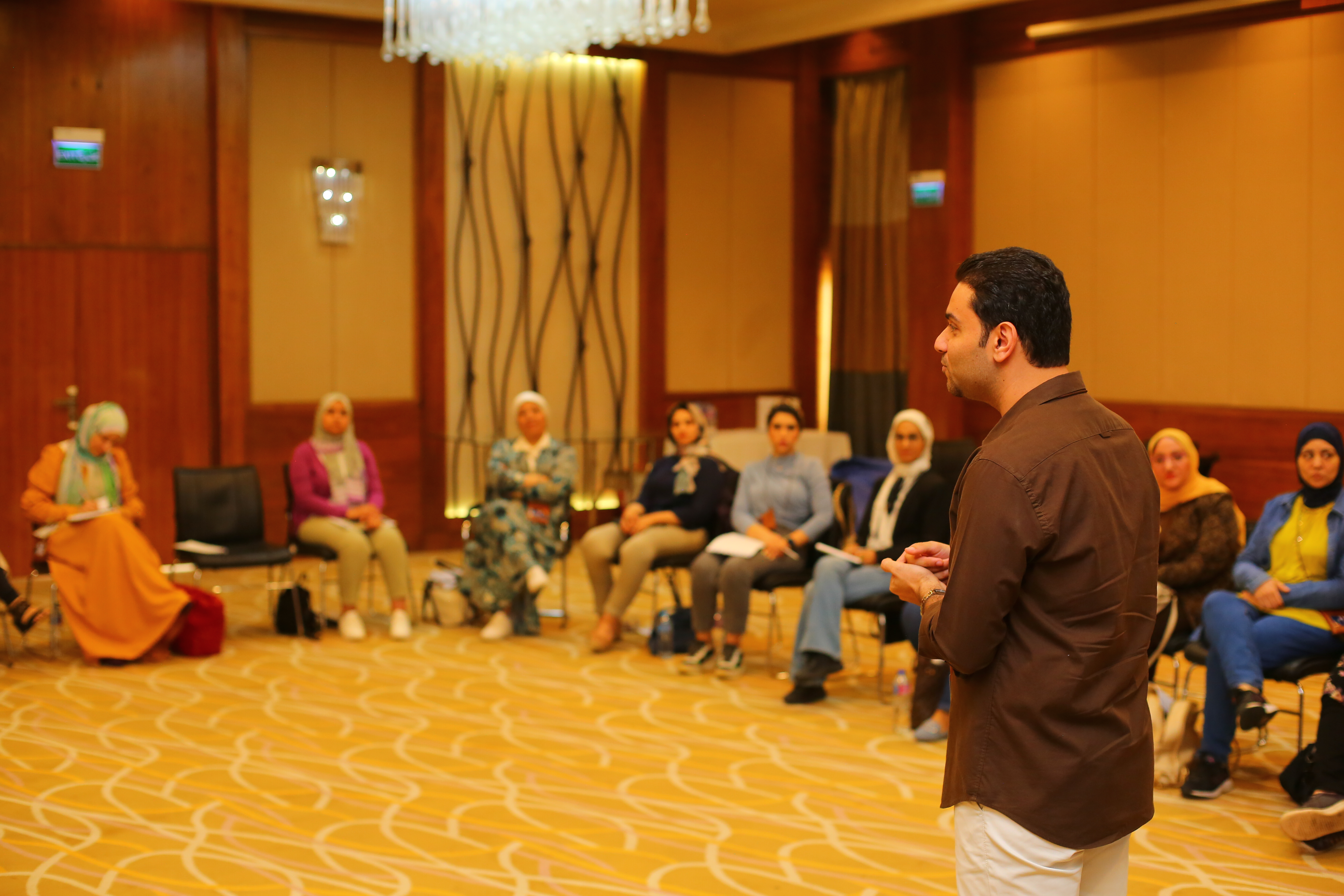 Ahmed Latif mentoring a participant during an ACC coaching session