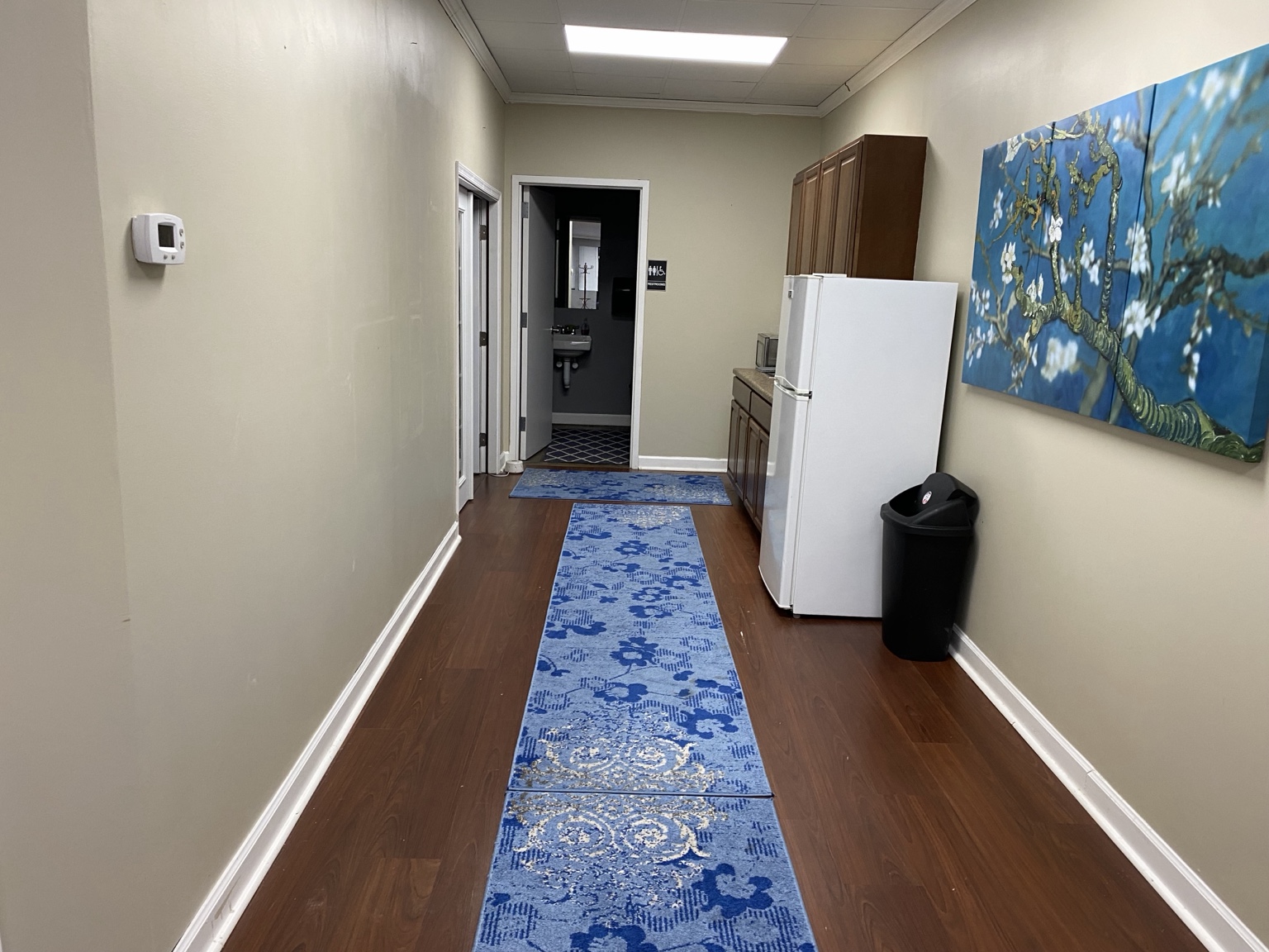 Finished neutral hallway in the renovated medical practice