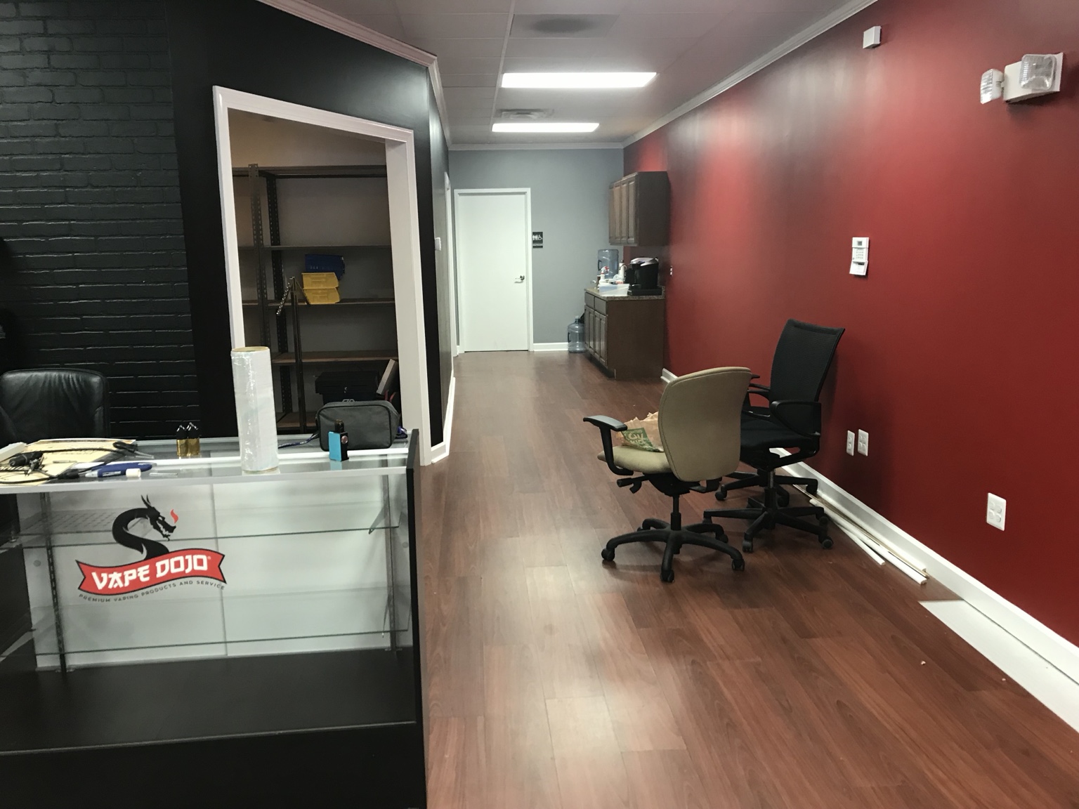 Before renovation: reception area with bold red walls
