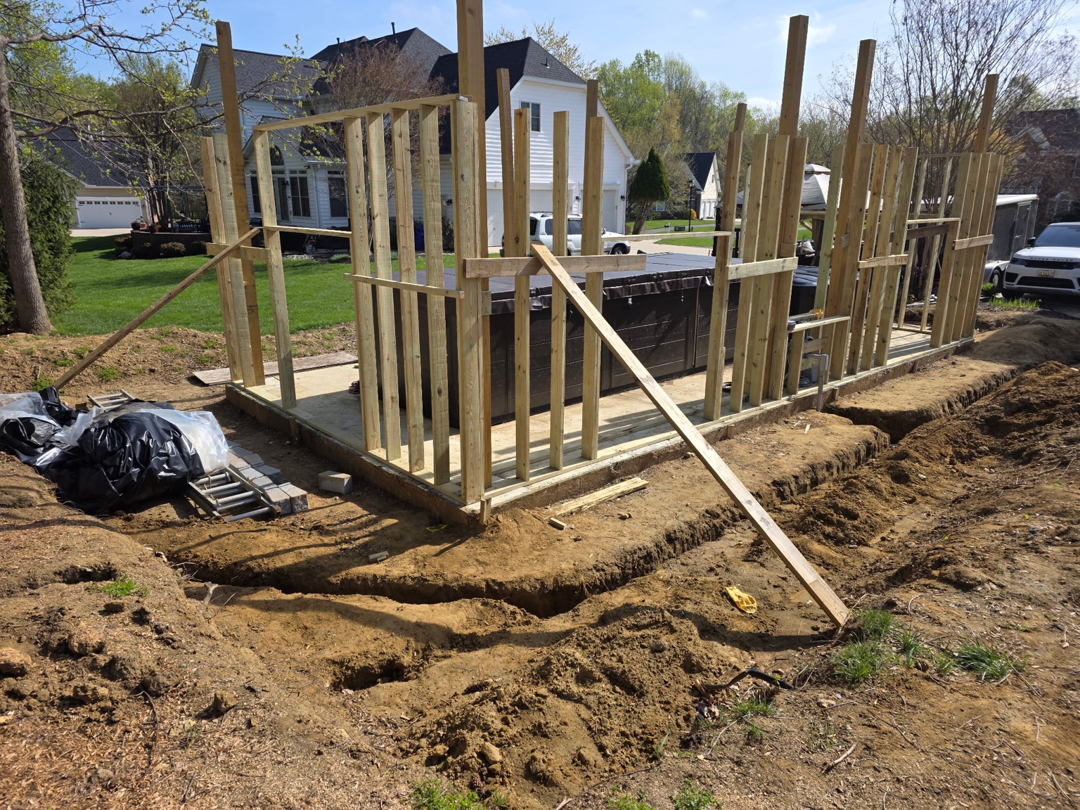 Wall framing rising around the outdoor whirlpool enclosure