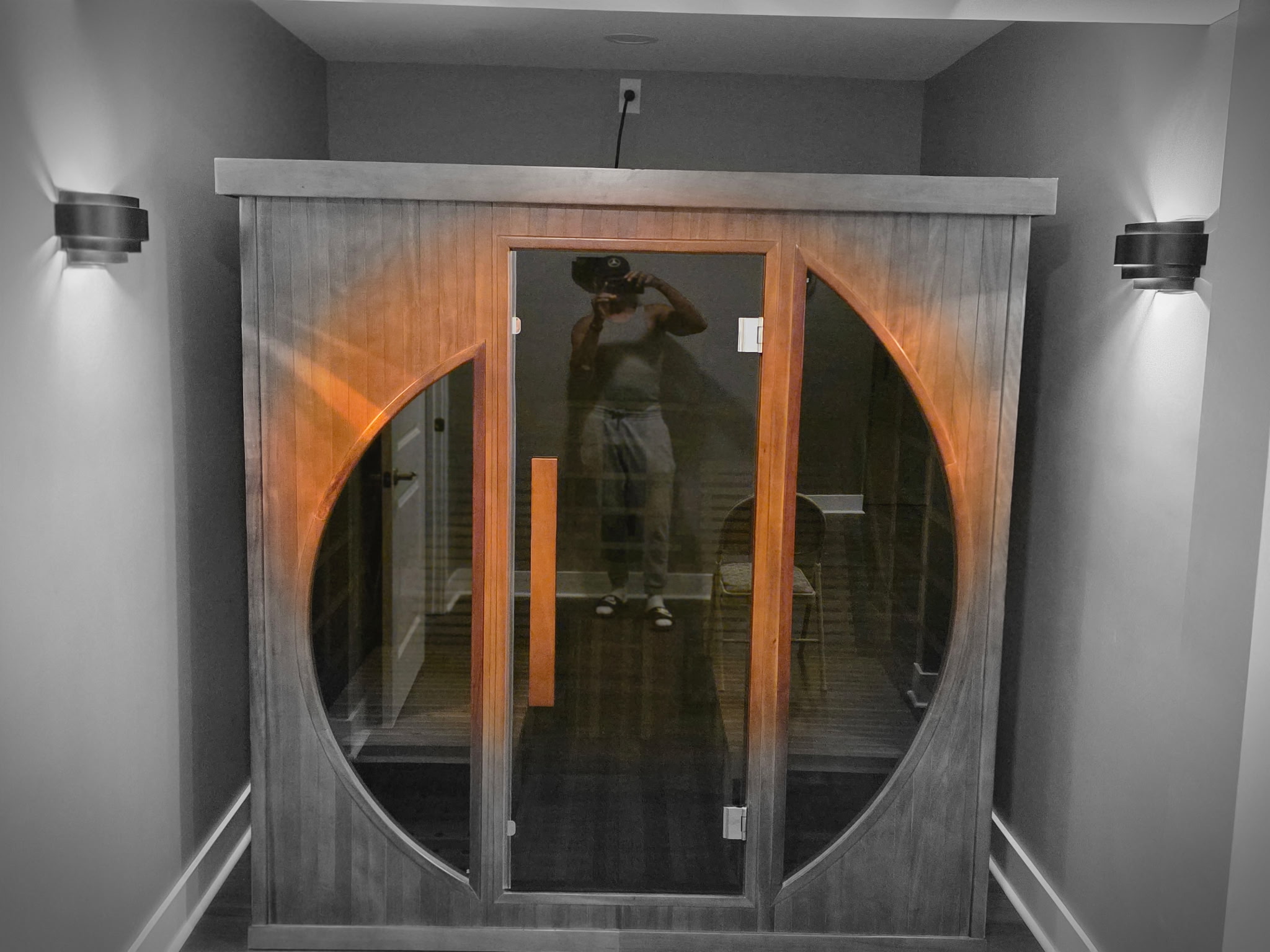 Finished sauna incorporated into a basement wellness remodel
