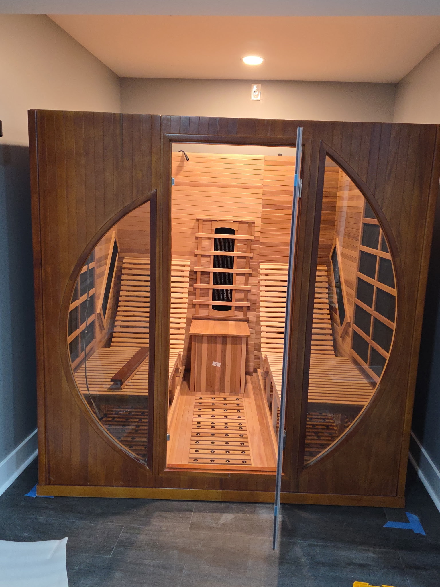Sauna interior with wood benches in basement wellness remodel