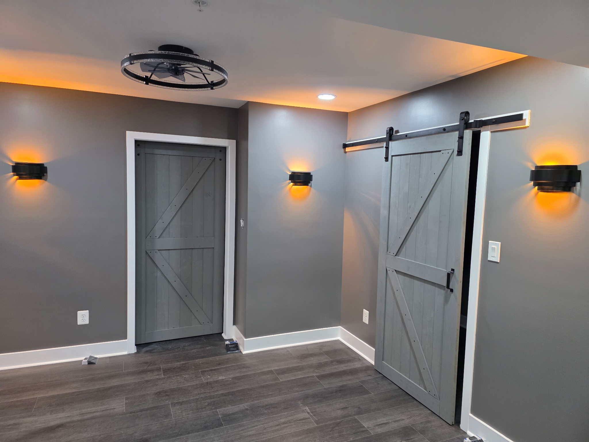 Custom Barn Door in basement remodel by Andre Horne