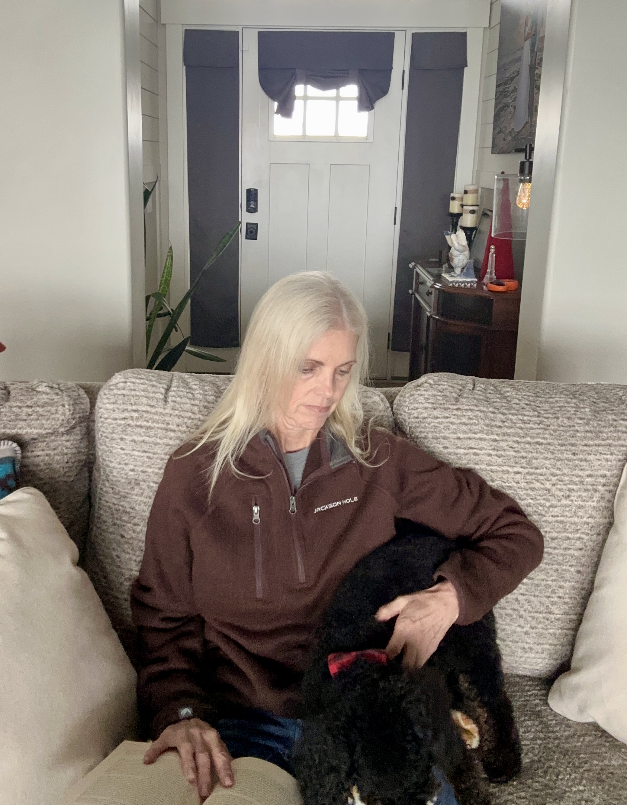 elizabeth reading book interrupted by dog playing