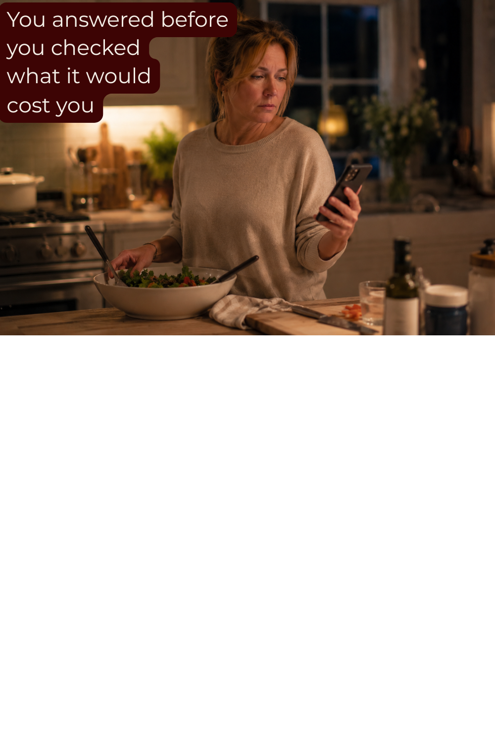 woman cooking distracted while replying to a text 