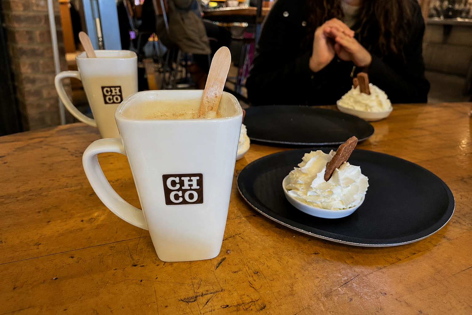 A cup of hot chocolate on a café table in Amsterdam, capturing an ordinary moment of slowing down and enjoying the present. A cup of hot chocolate on a café table in Amsterdam, capturing an ordinary moment of slowing down and enjoying the present.