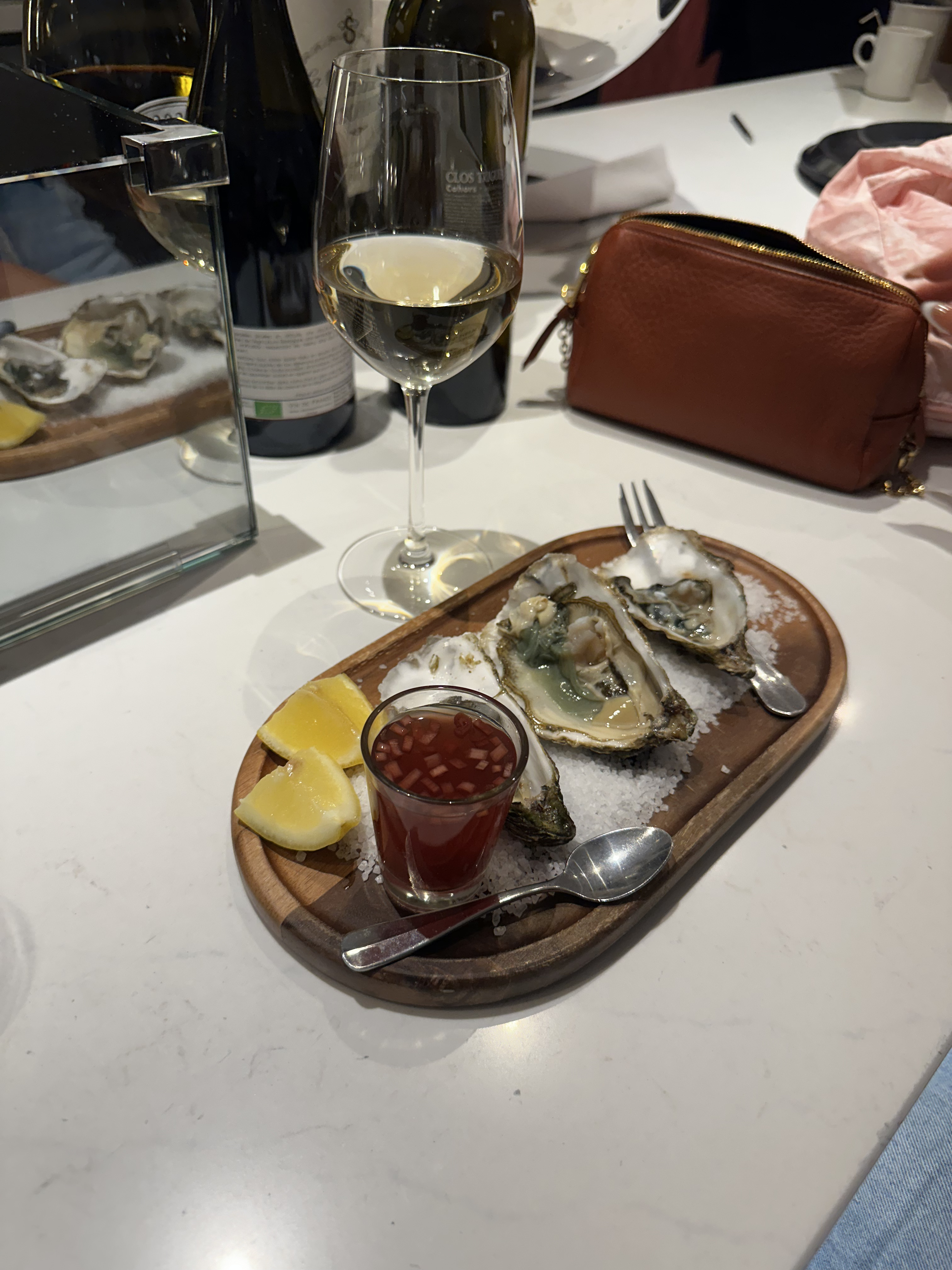 Oysters and wine at a restaurant