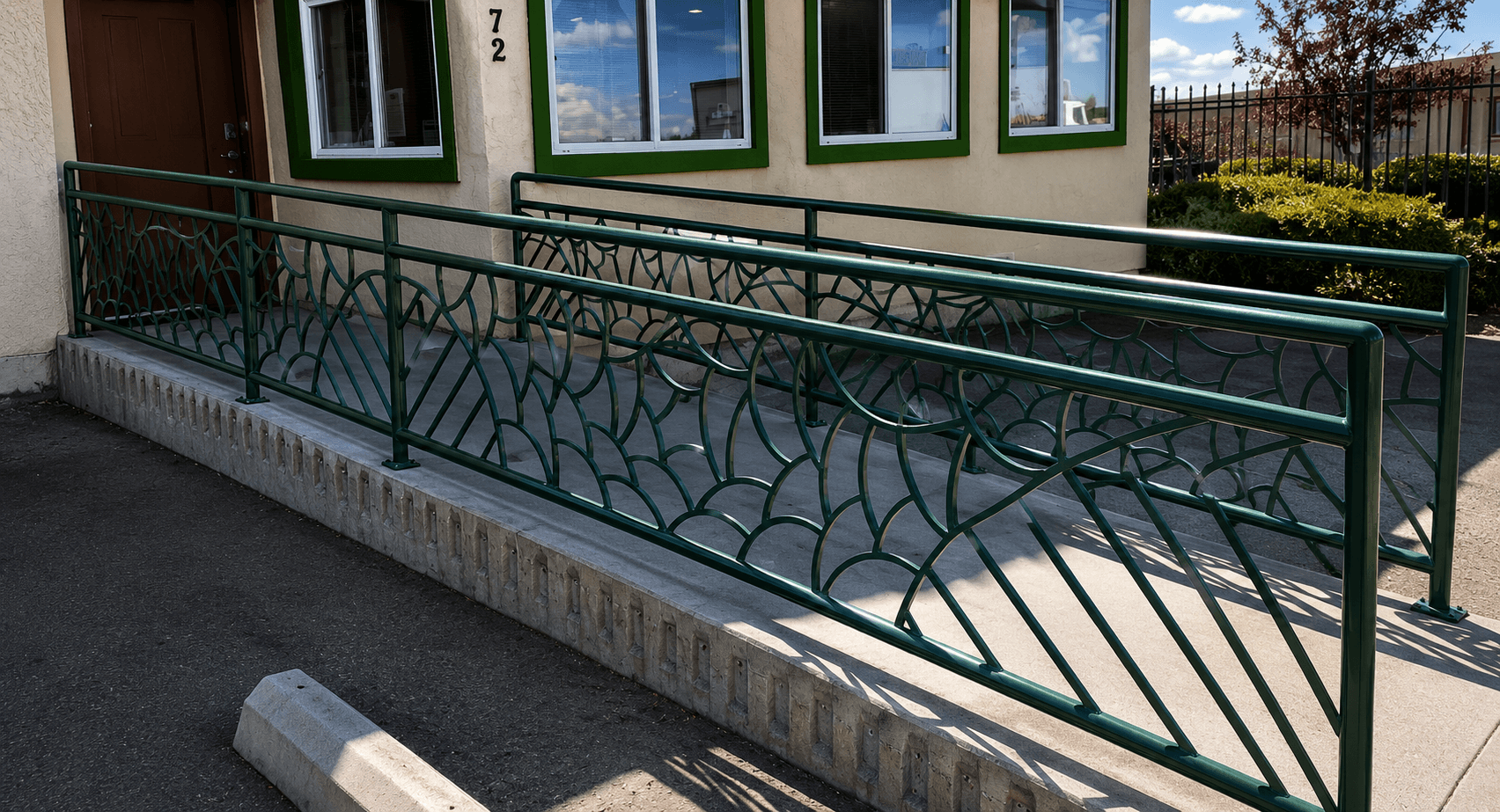 Custom green iron railing fabricated by Kodiak Gates & Iron.
