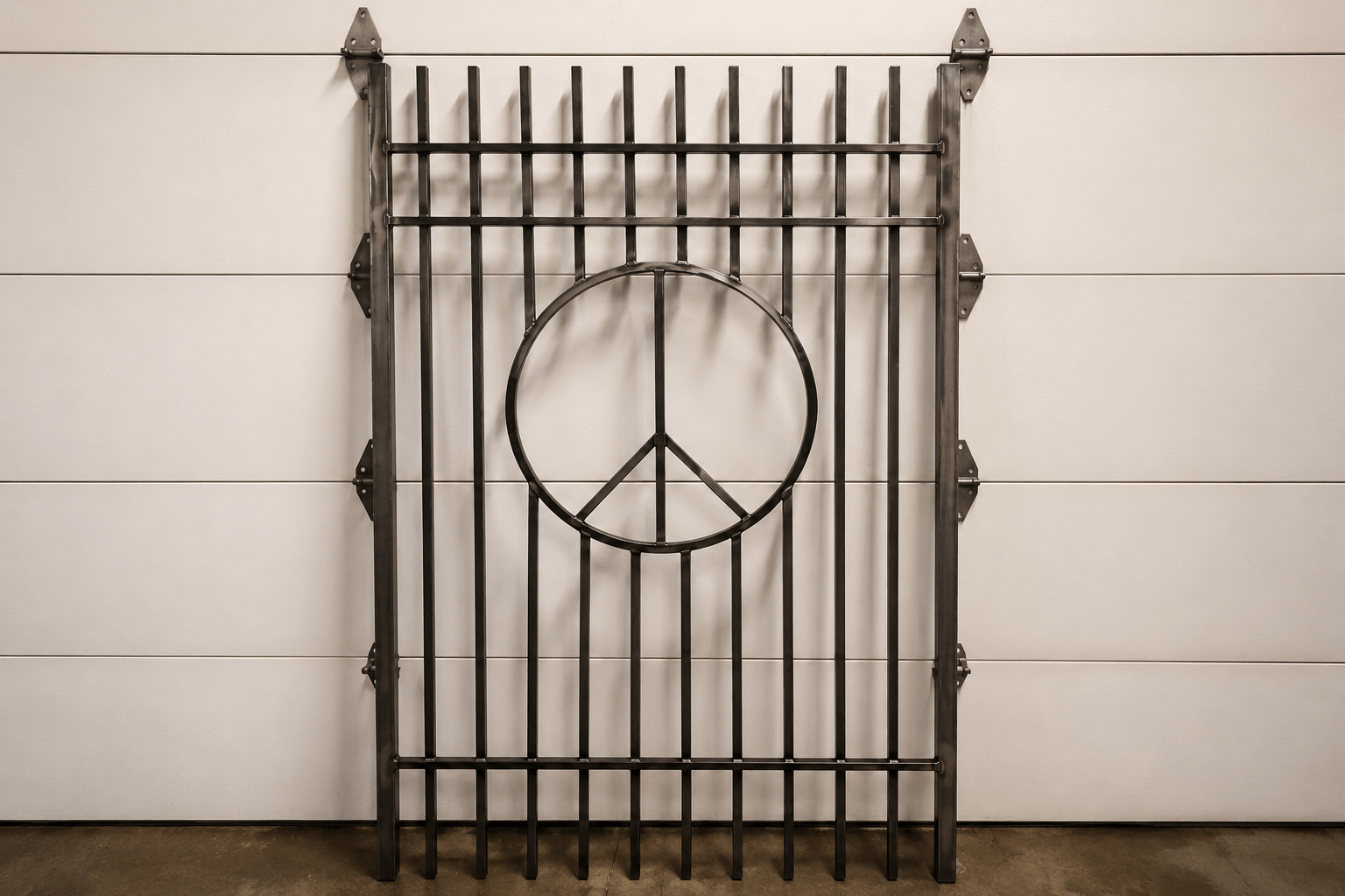 Custom peace sign iron decorative metalwork fabricated by Kodiak Gates & Iron.
