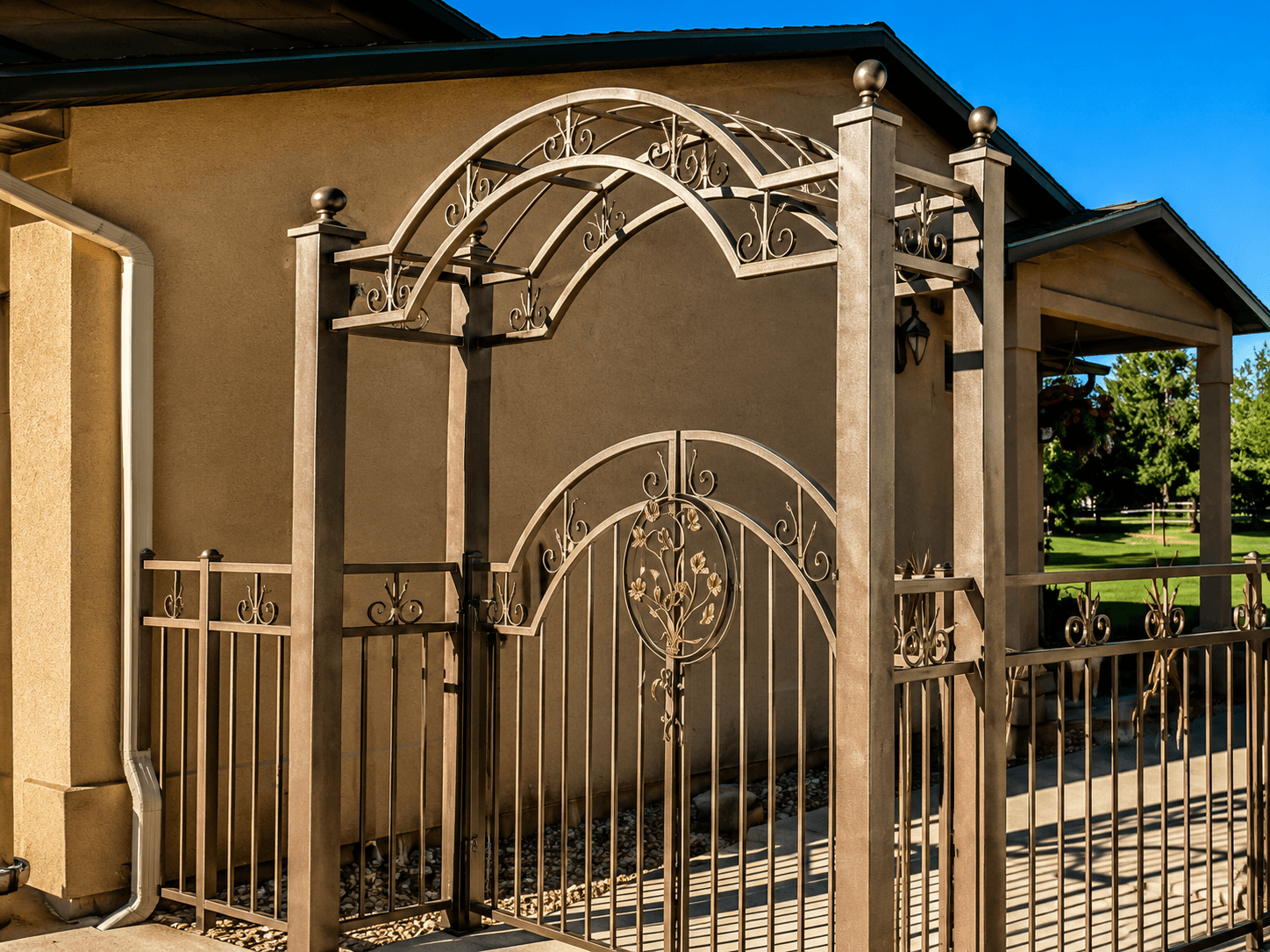 Tall custom iron backyard gate fabricated by Kodiak Gates & Iron in Star, Idaho.
