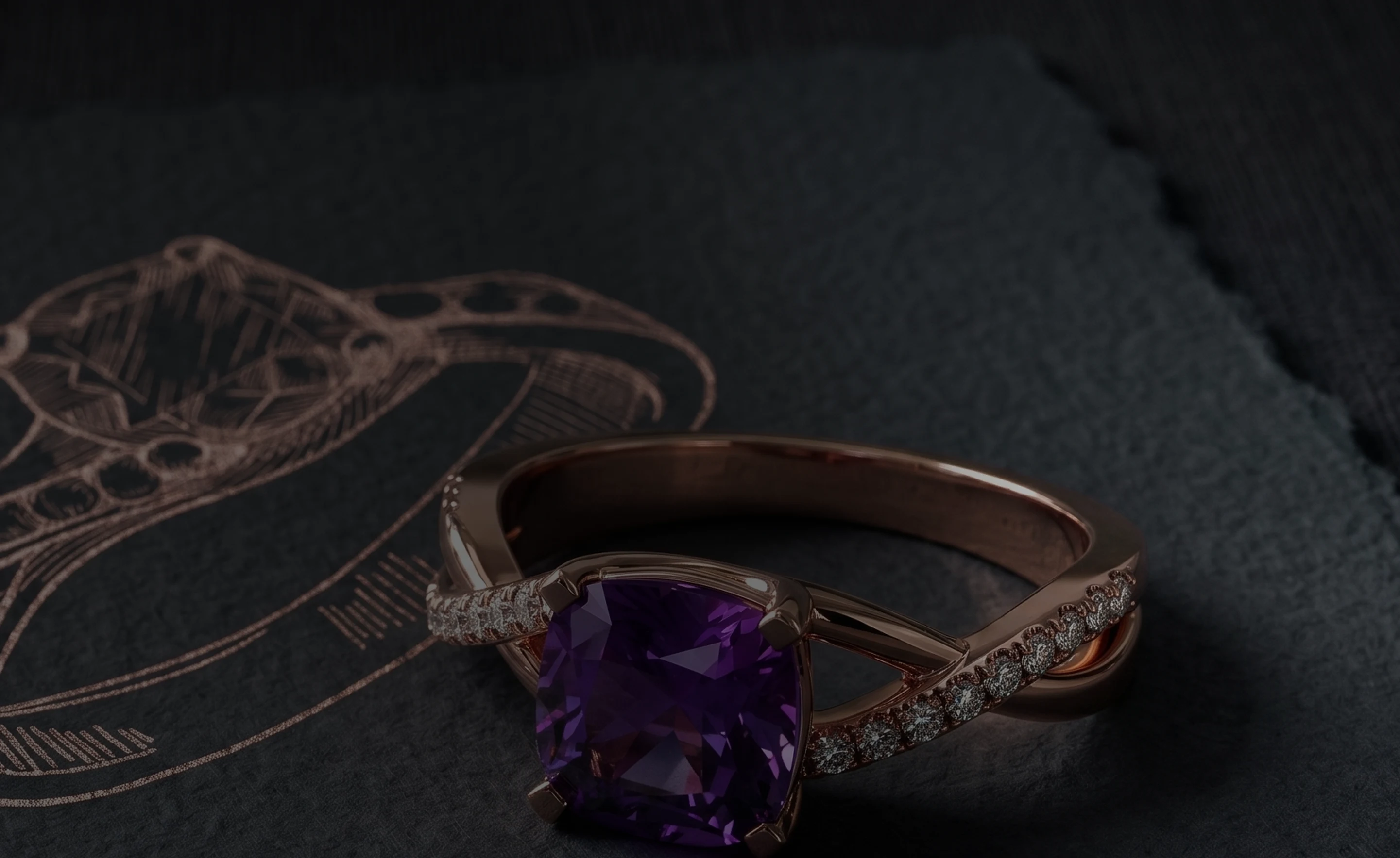 Rose gold ring with a cushion-cut amethyst resting on dark slate
