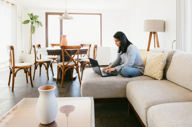 Working on couch with laptop Working on couch with laptop