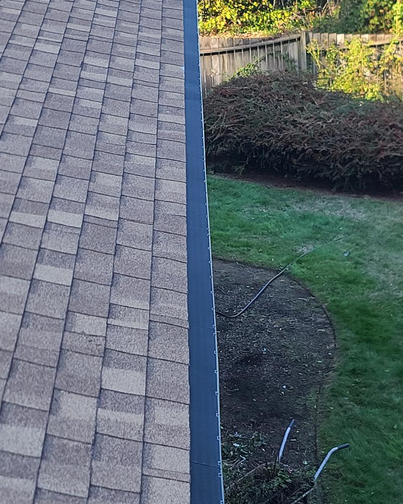 Long straight run of Raindrop gutter guard along a back eave