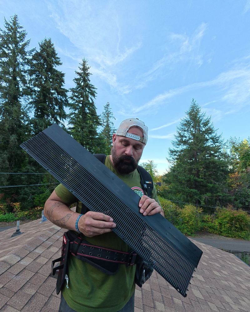 Shane holding a section of Raindrop gutter guard