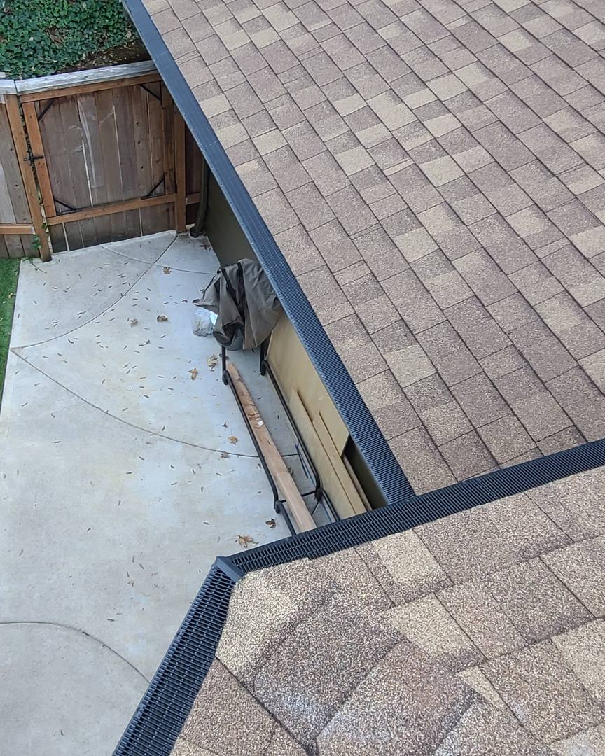 Raindrop gutter guard mitered at an inside corner, with straight runs going both ways above a side patio