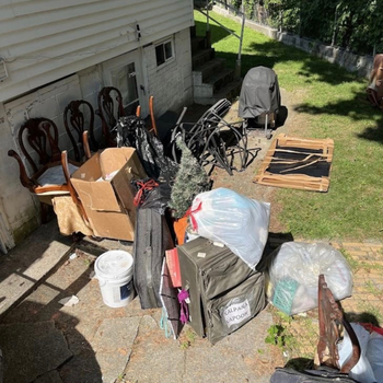 Full-property junk haul in a Twin Cities backyard