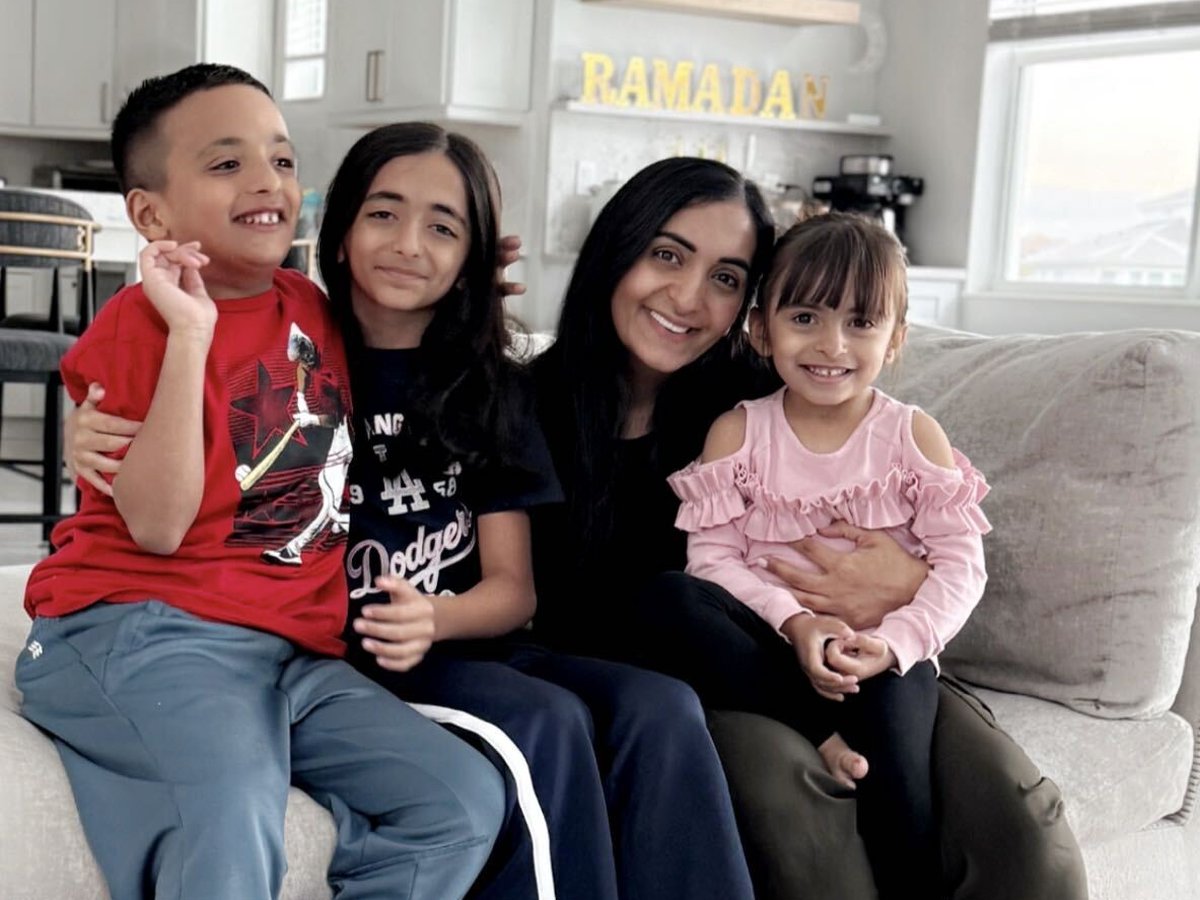 Isra with her three children