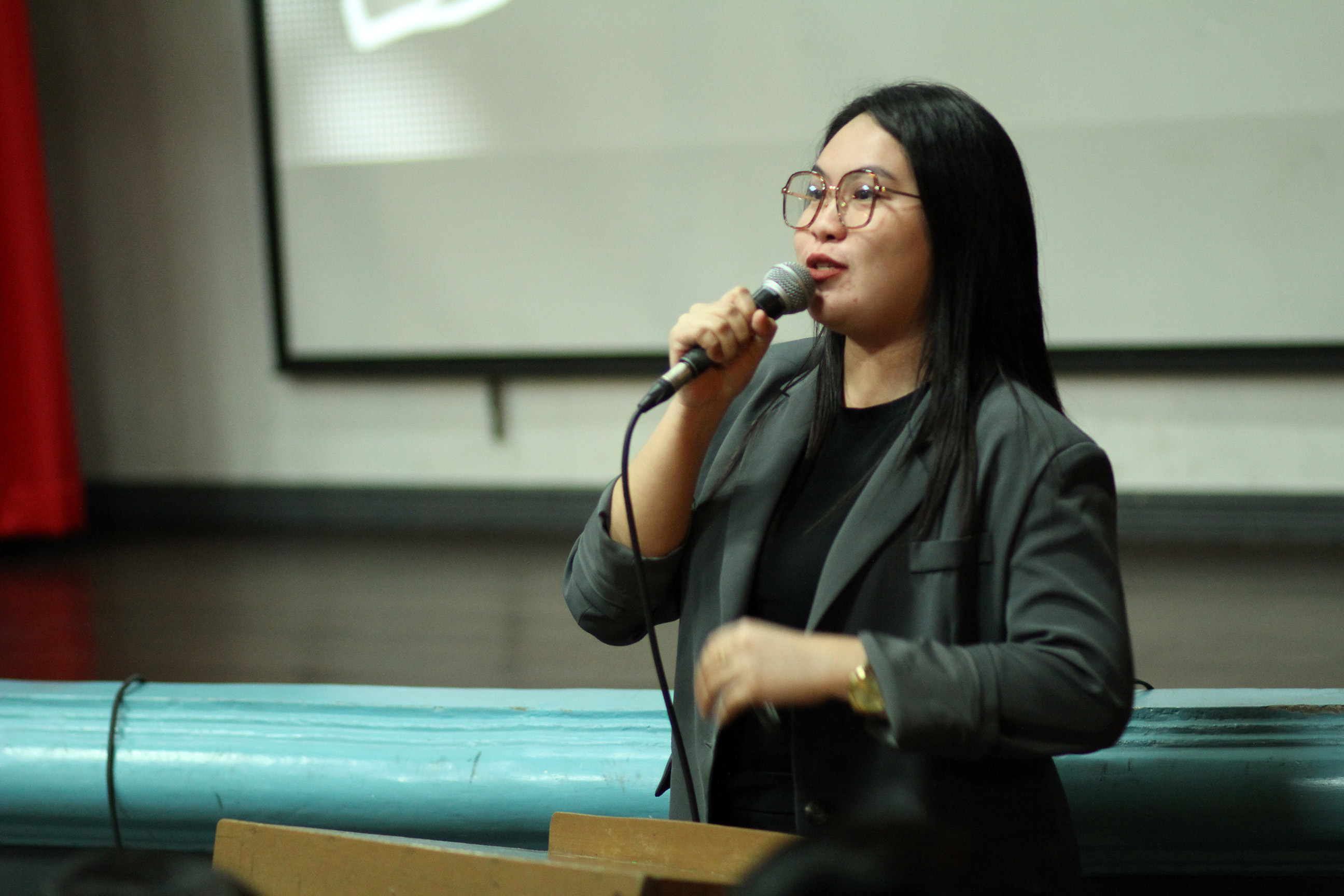 Sarah speaking on stage