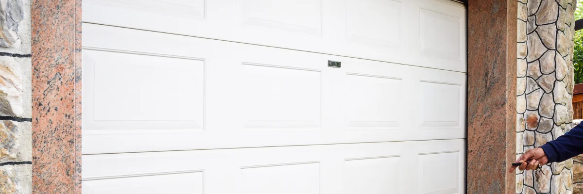 Automatic white garage door opening using handheld remote.