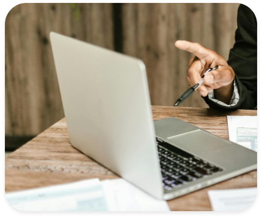 Close up of an accountant working from a laptop