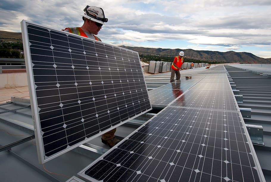 Techs installing solar panels