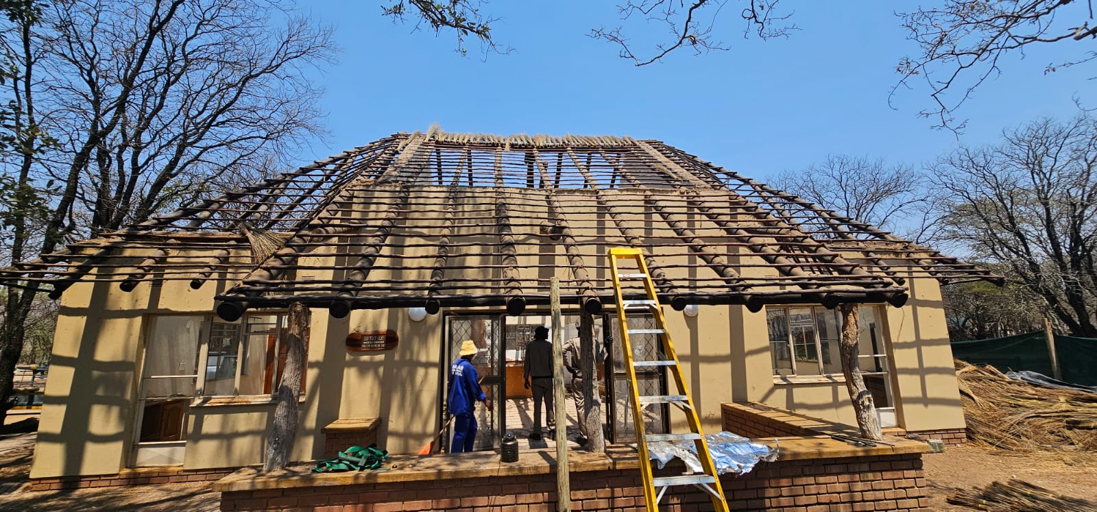 Before restoration: Aging residential roof with damaged tiles and structural wear